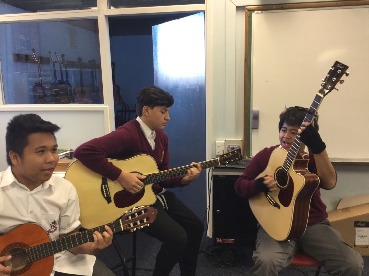 music students playing guitar
